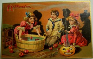 kids bob for apples in vintage halloween card