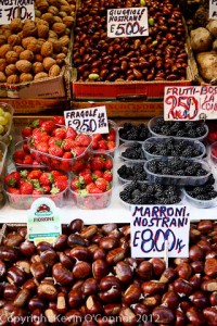 Italian berries and nuts at food market in Bologna, Italy