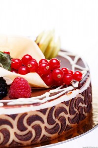 Fresh berries atop a chocolate cake