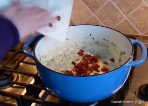 preparing warm spinach and bacon dip.