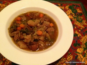 Cooked stew in a white bowl