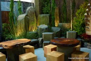 Giant boulders, wood slab tables and square wooden chairs decorate this nature-inspired wine bar at 2013 northwest flower and garden show