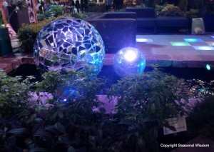 blue disco-inspired balls in stone pond