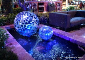 Giant blue balls in water garden