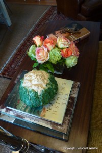 Flowers, books and decorative objects in P. Allen Smith's home.