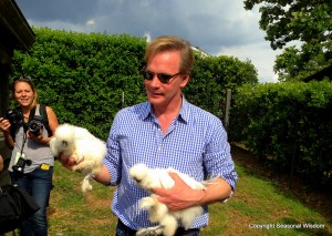 P. Allen Smith holds two white silkie hens.