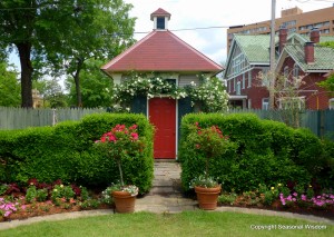 Cute red and blue shed in P. Allen Smith's garden.