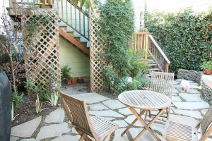 Installing single lattice trellis in garden.