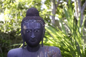 A four-foot buddha is part of the garden designed by Billy Goodnick.