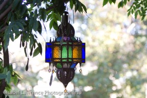 A colorful lantern hangs from the pergola on Billy Goodnick tour.