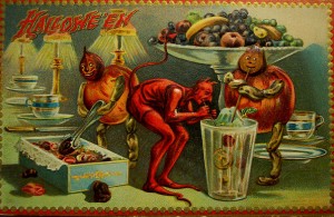 Halloween devils get into the candy in this vintage halloween card