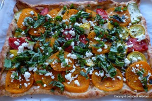 Harvest tart with tomatoes, squashes and lots of herbs.