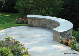 A curved bench and circular patio make a great power spot in the garden.