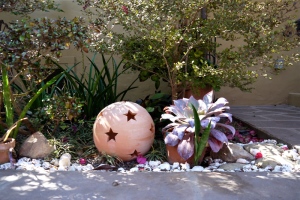 Garden art and succulents in water-wise garden