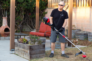 troy-bilt trimmer being used