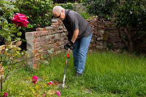 Troy-Bilt brush cutter near a wall 